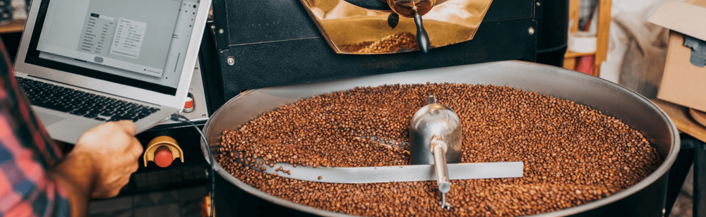 Coffee beans being roasted in the industrial coffee roaster