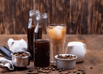 Water and milk cold brew coffee packed in glass