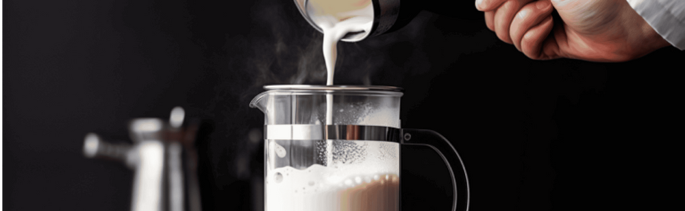 Person frothing milk in the French press