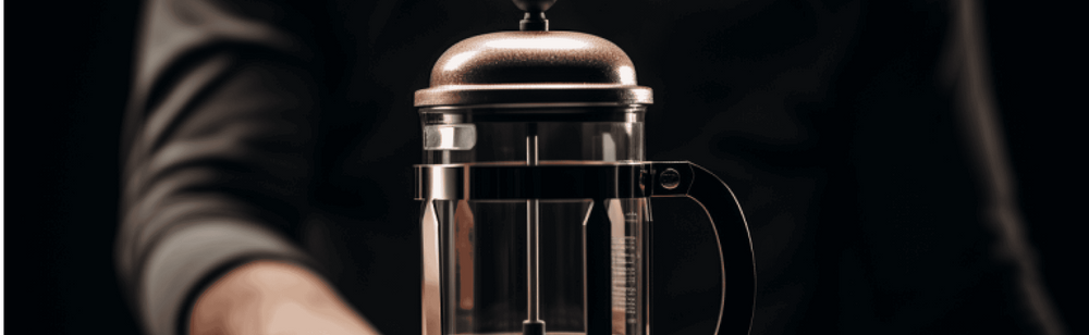 Man holding french press coffee maker
