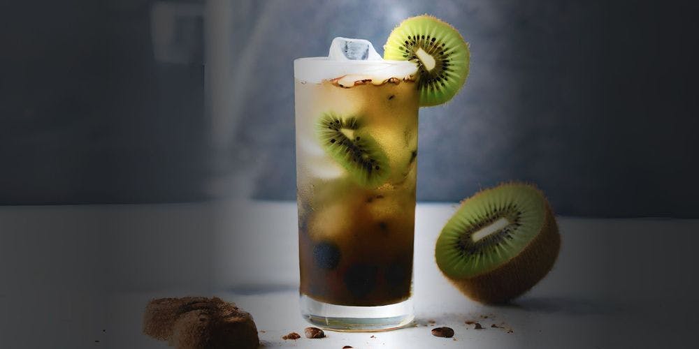 Kiwi espresso tonic filled in a glass garnished with a slice of kiwi
