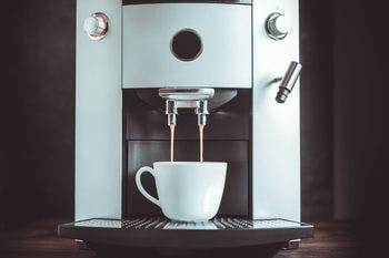 In wall coffee machine pulling espresso shots